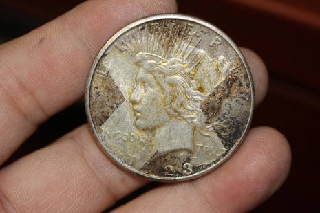 A 1923-s Peace Silver Dollar: as shown