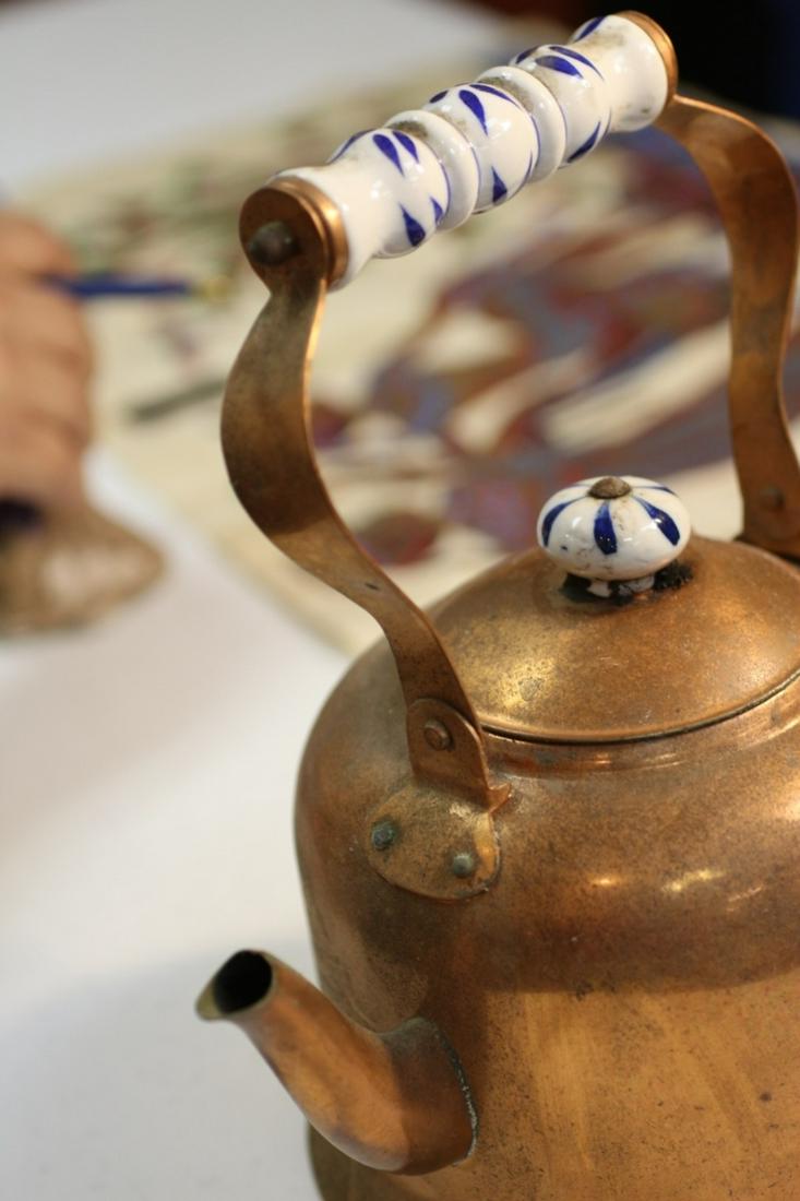 A Copper Kettle: 10" tall up to the handle
