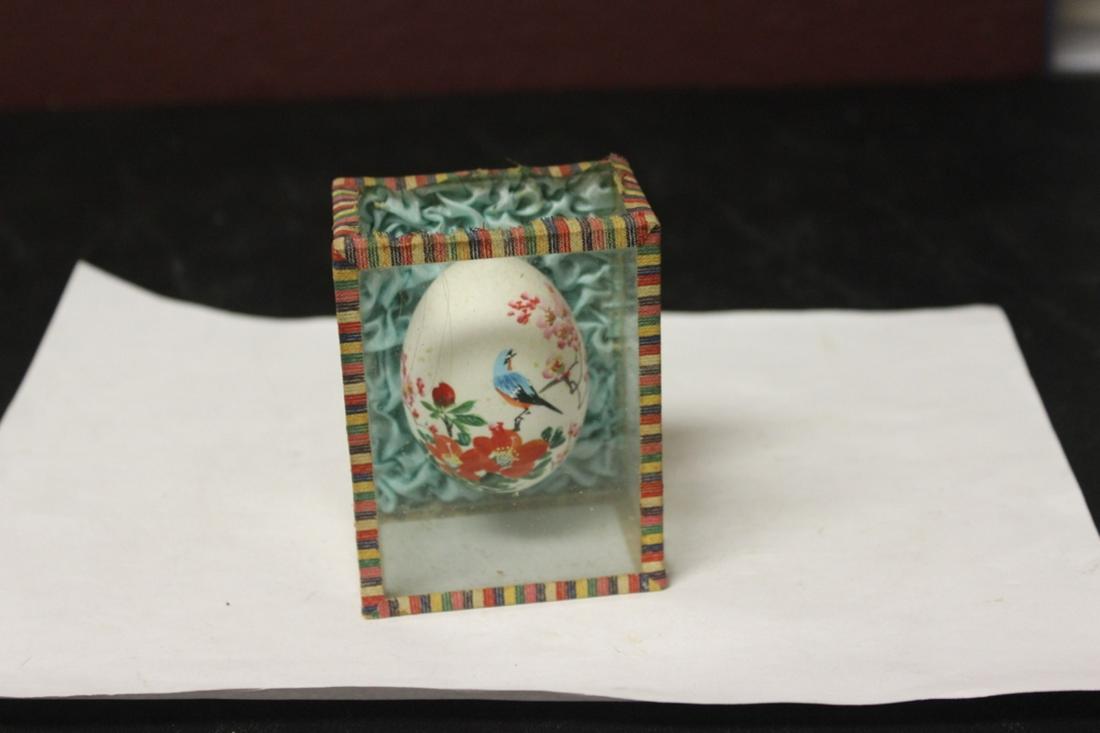 An Oriental Egg Inside a Glass Shadow Box: As shown on photos