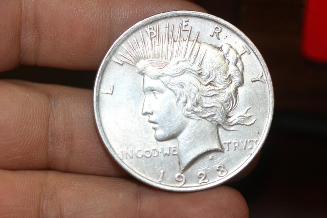 A 1923 Peace Silver Dollar: as shown