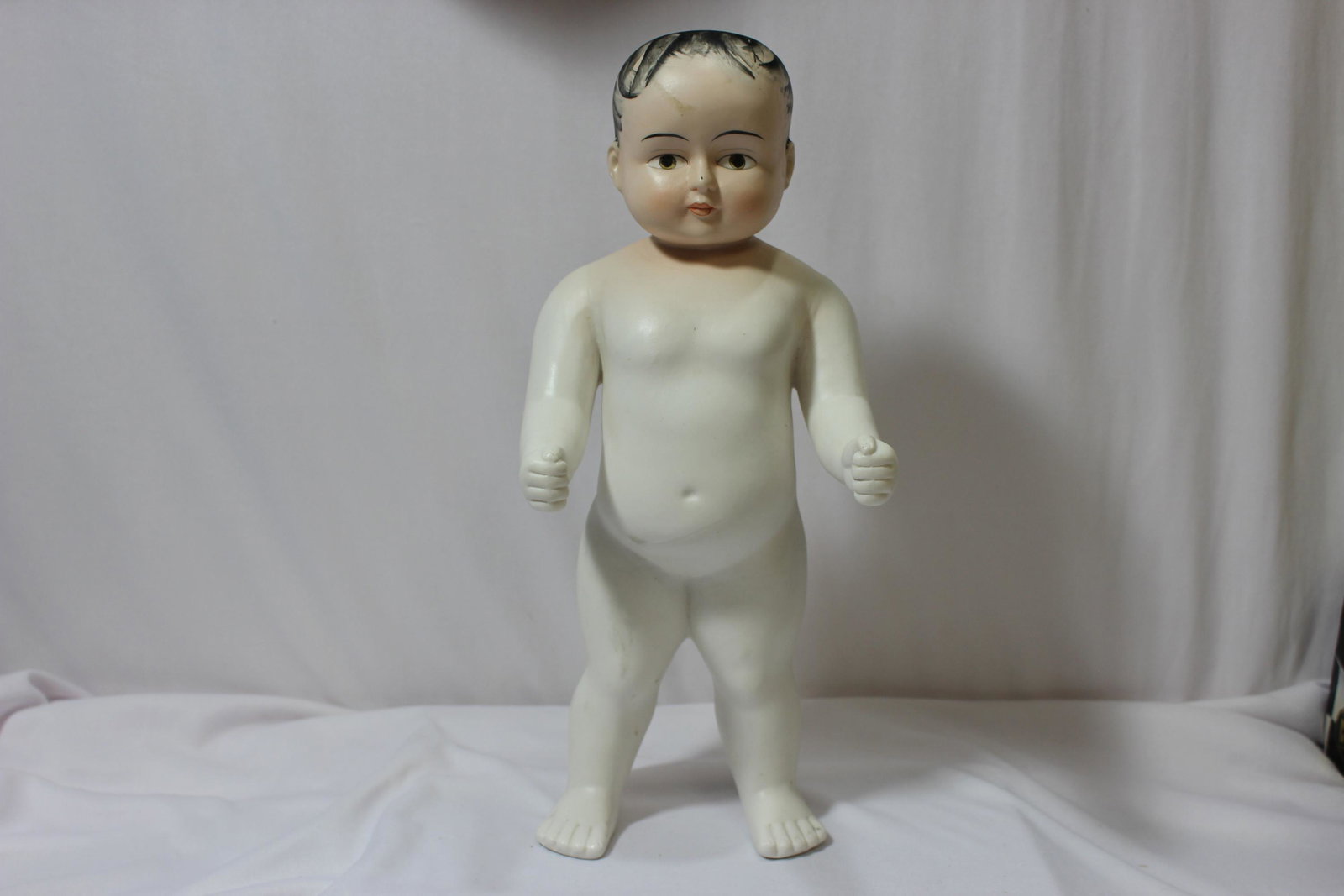 A Vintage Bisque Doll: 13" tall