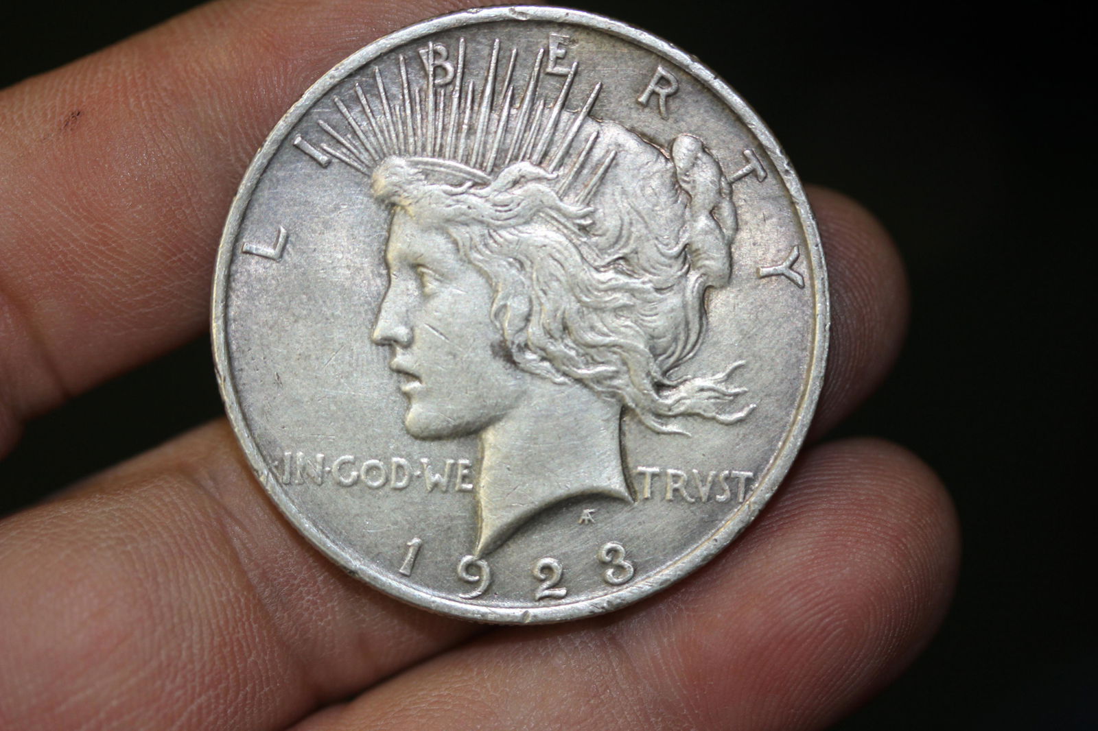 A 1923 Peace Silver Dollar: as shown
