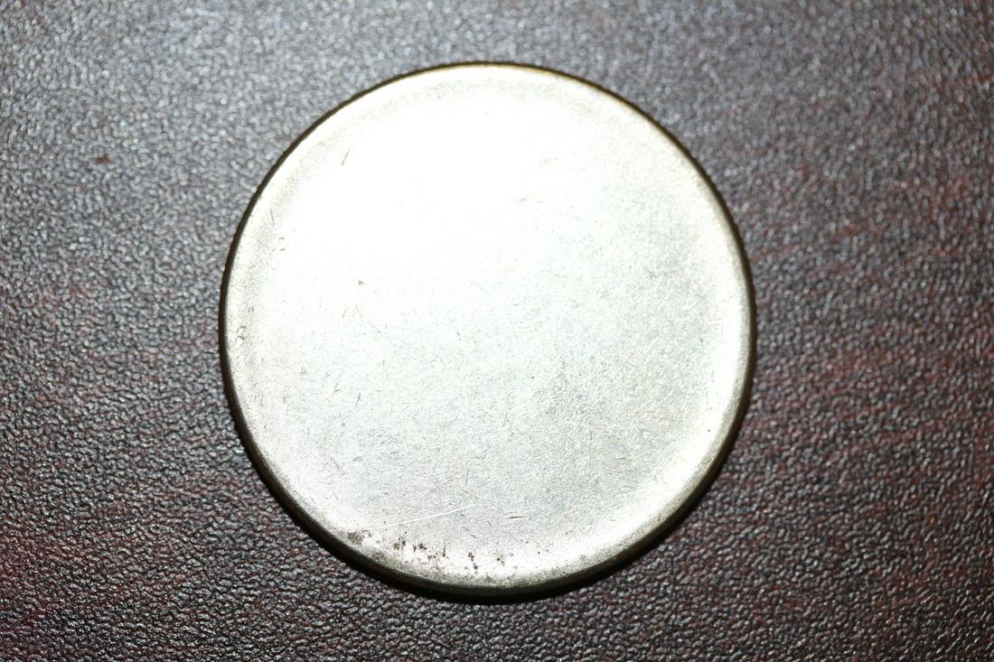 A Mint Error Clad Half Dollar Planchet: as shown