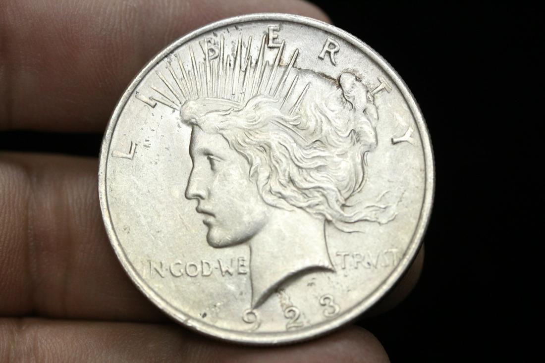 A 1923 Peace Silver Dollar: as shown