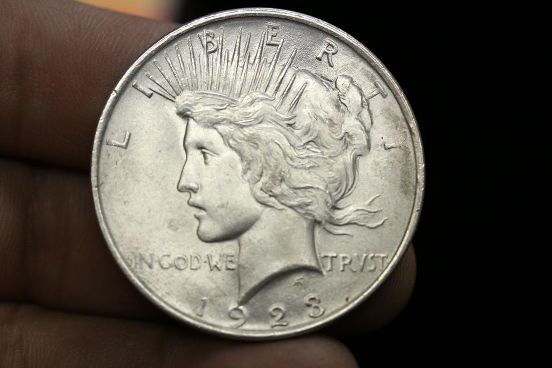 A 1923 Peace Silver Dollar: as shown