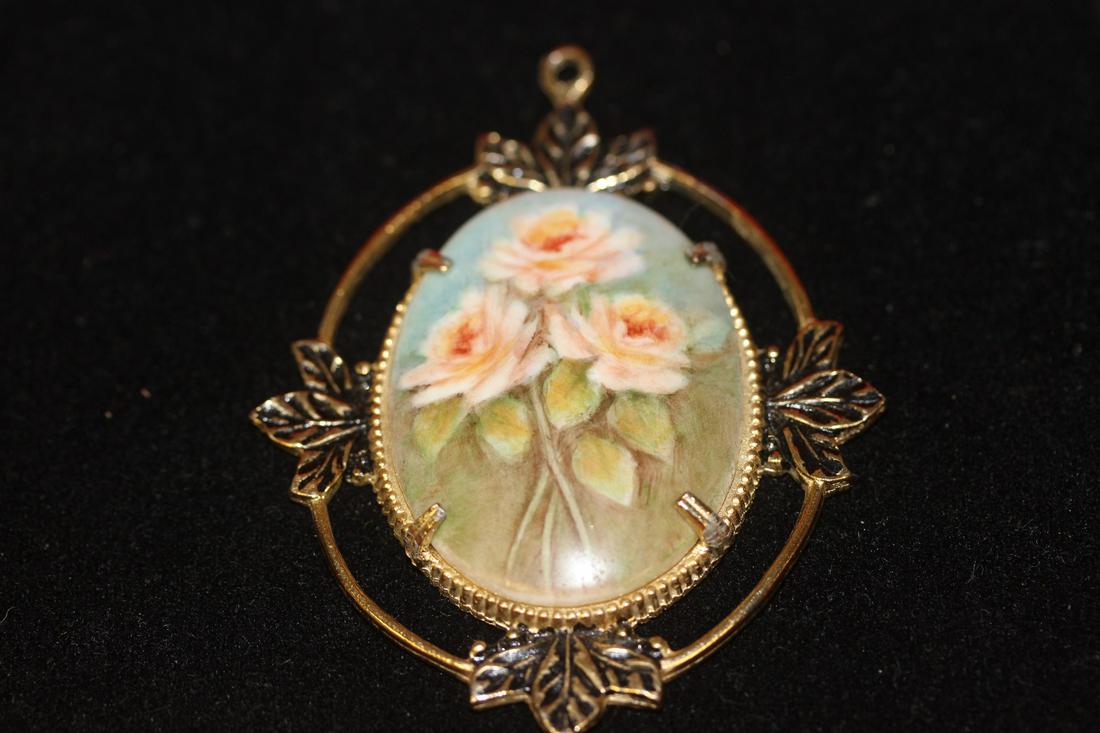 A Porcelain Hand Painted Pendant: Signed on the reverse
