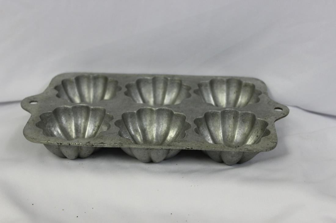 A Cake Mold: Aluminum - vintage - 10" in length
