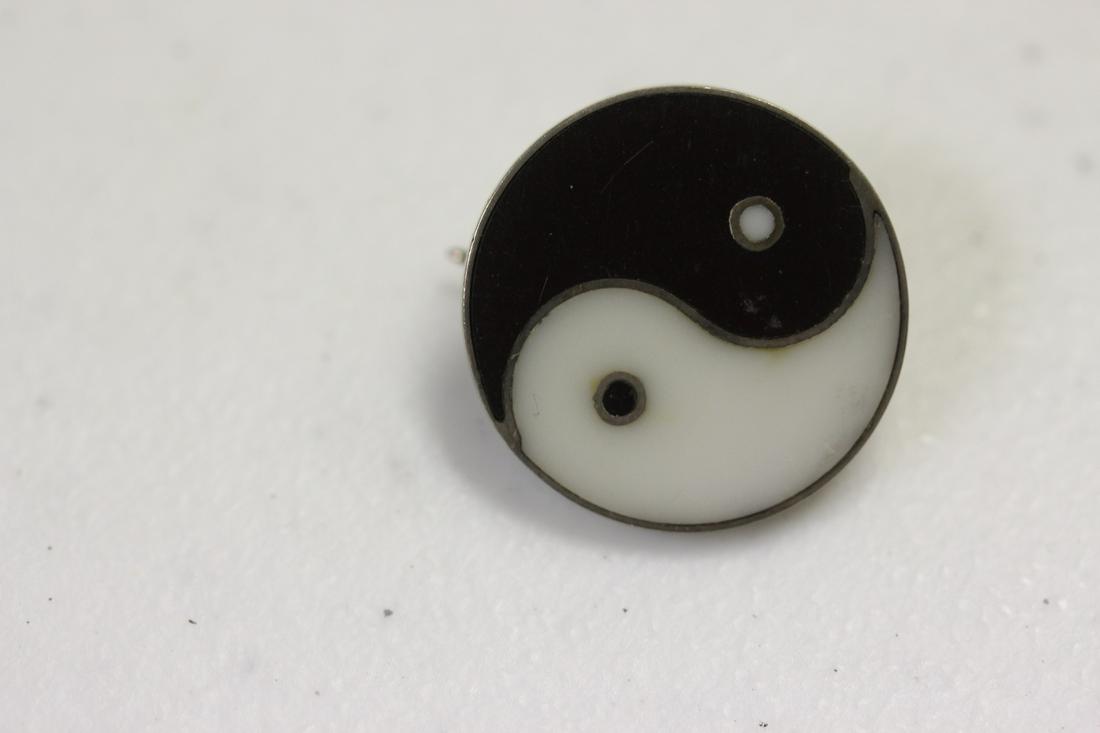 An Enamel Sterling Pin: a little less than a size of a quarter
