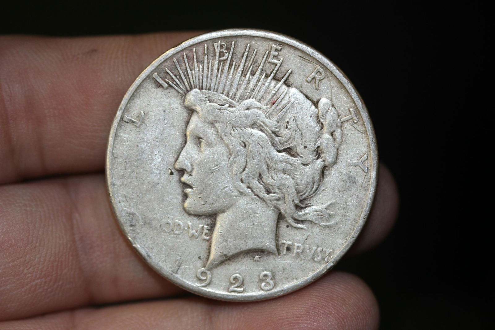 A 1923-S Peace Silver Dollar: as shown
