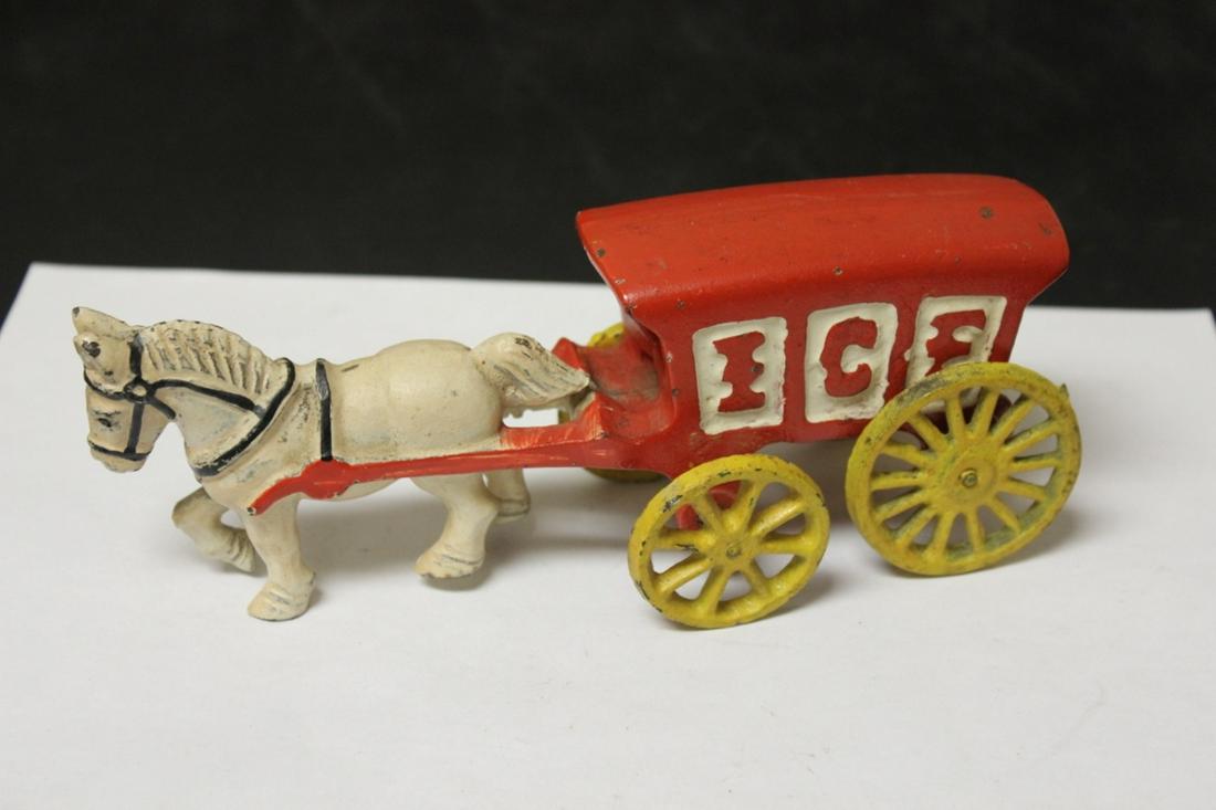A Cast Iron Wagon: 7 5/8" long