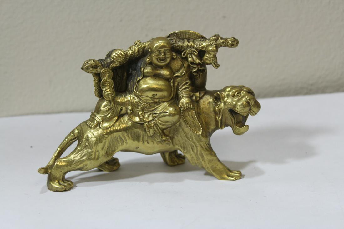 A Chinese Brass Buddha on Tiger Statue: 5 inches across