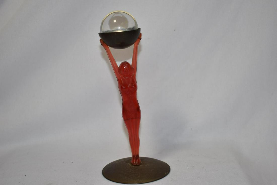 A Bakelite Deco Nude Lady: holding a glass ball - 7 1/8" tall
