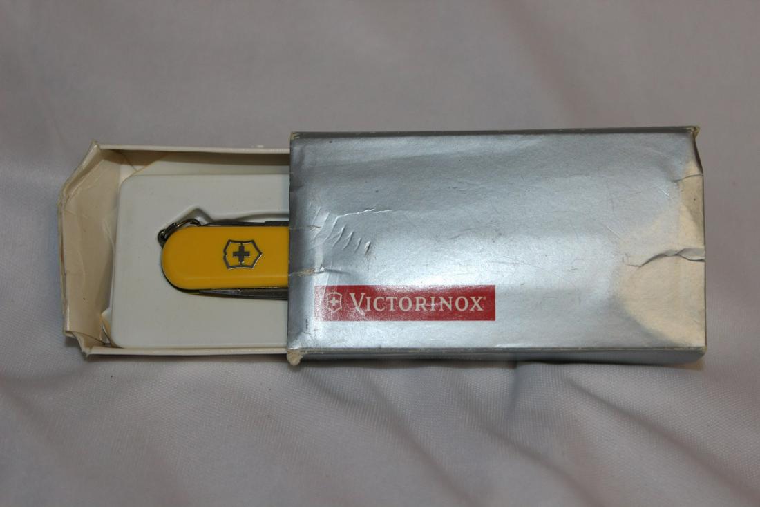 Victorinox Swiss Army Knife: yellow - 2 1/2" across