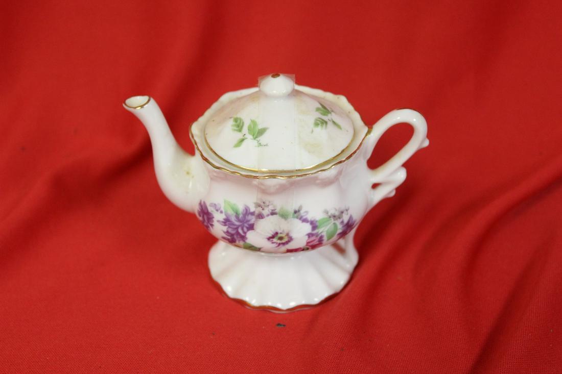 A Miniature Teapot: 4" across