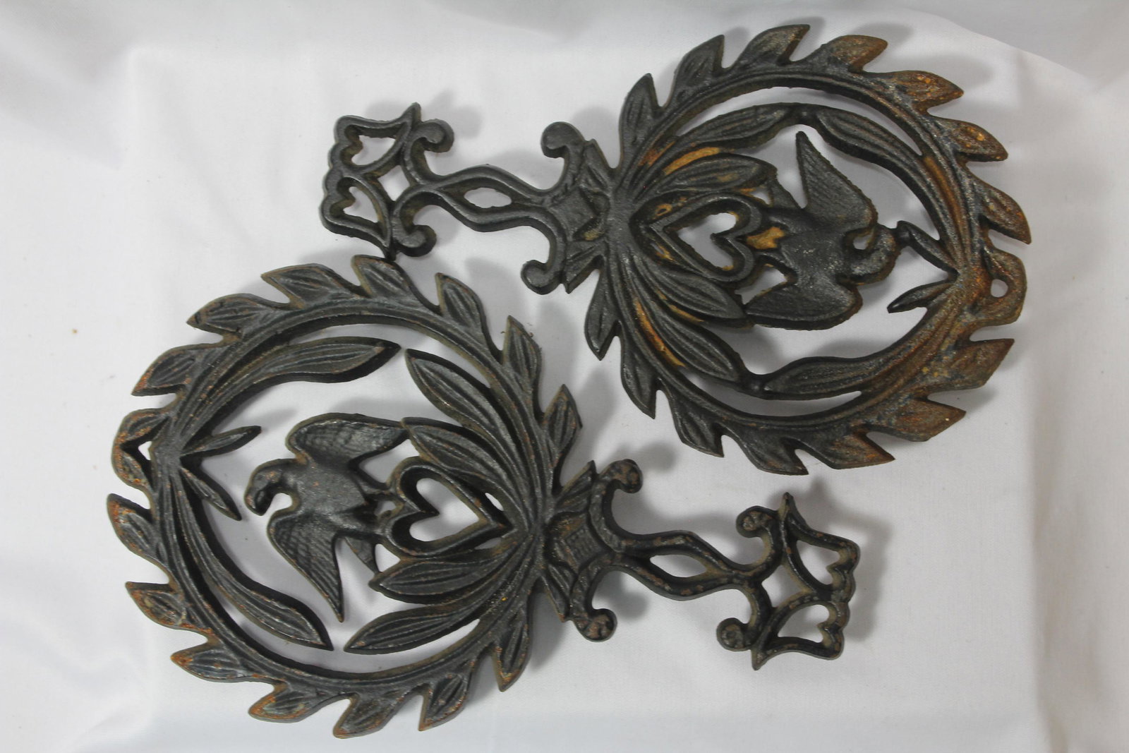 Lot of 2 Cast Iron Trivets: larger one= 5 1/2" wide