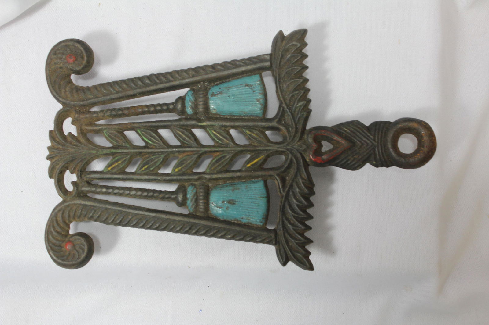 A Cast Iron Trivet: 8 1/2" long - including the handle