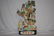 A Chinese Ceramic Sage Figurine with Children and Swans