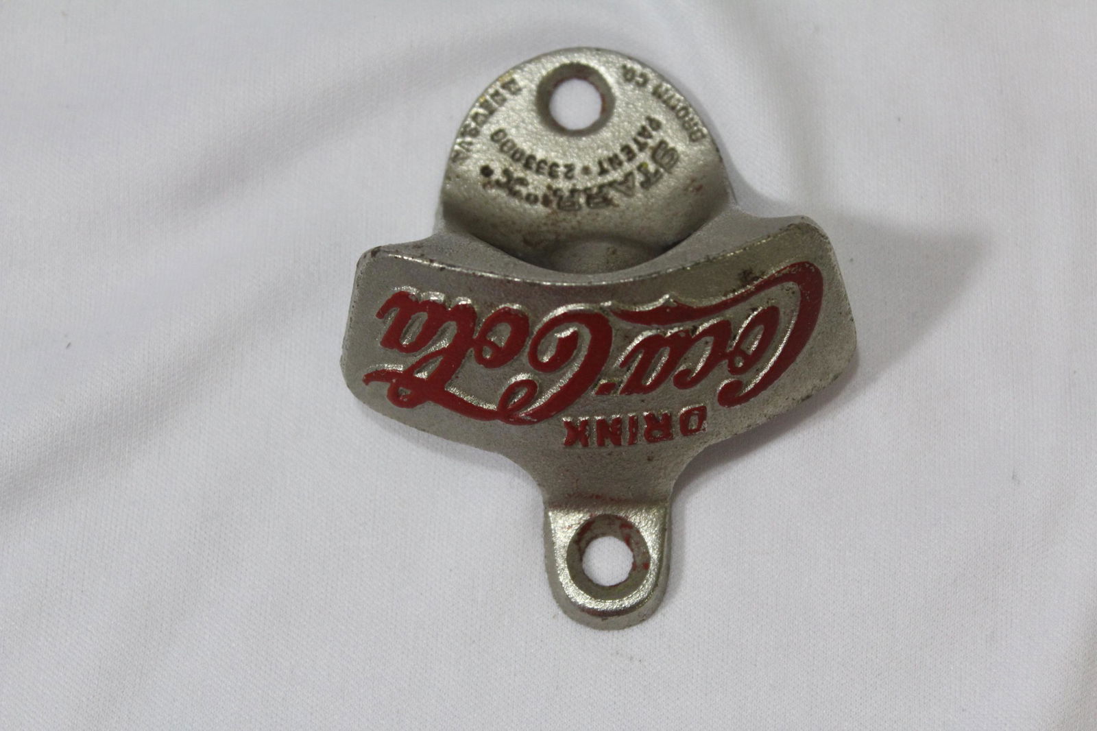 A Vintage Metal Coca Cola Bottle Opener: as shown