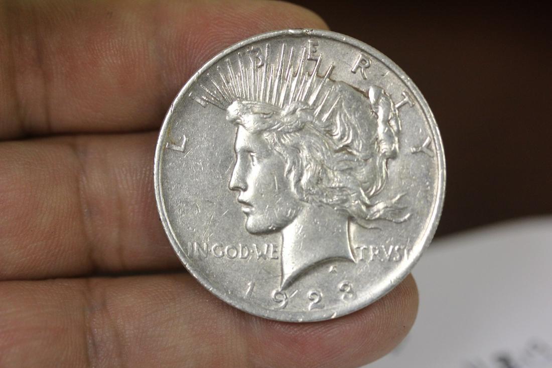 A 1923 Peace Silver Dollar: as shown