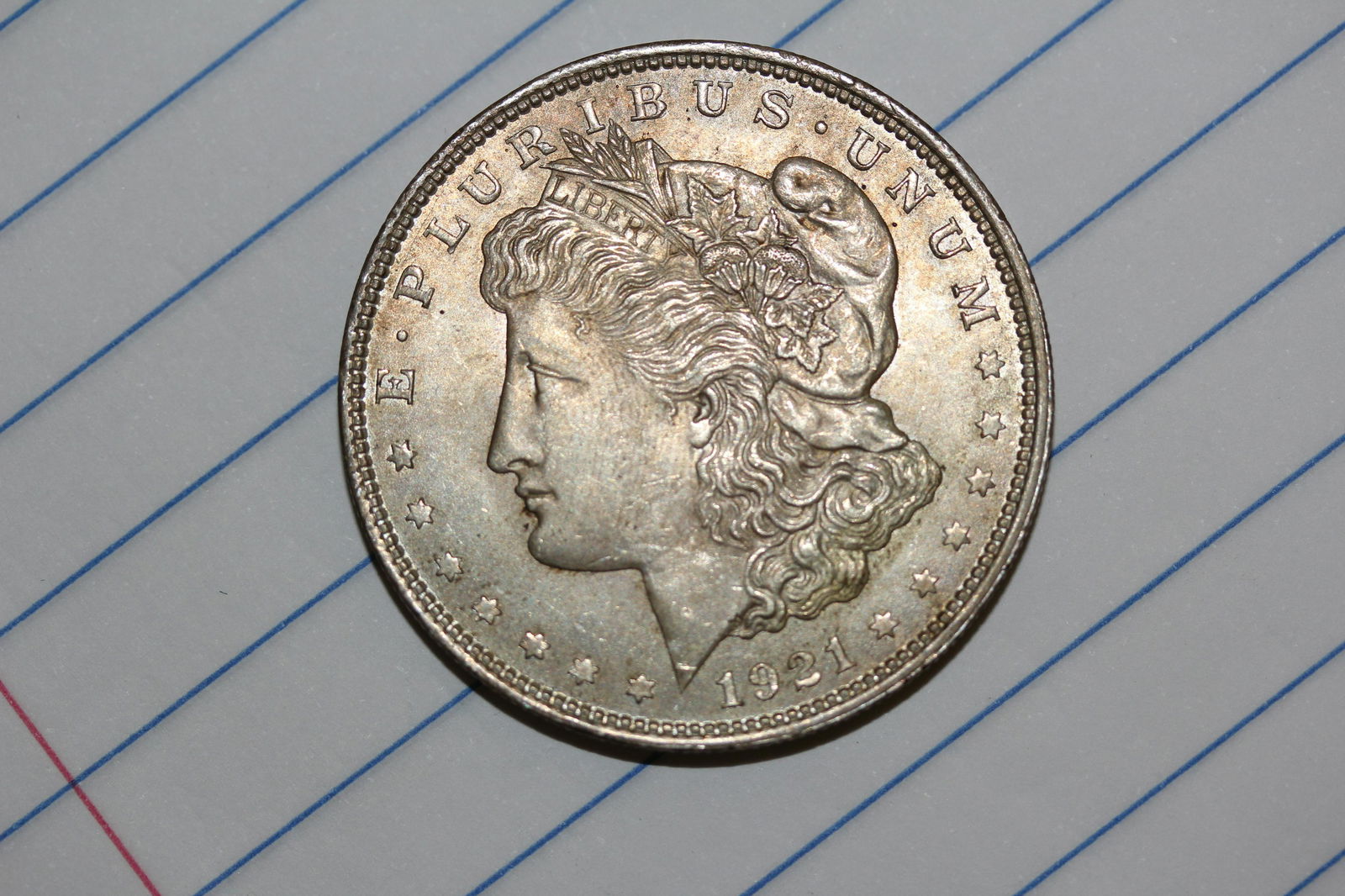 A 1921 Morgan Silver Dollar: as shown