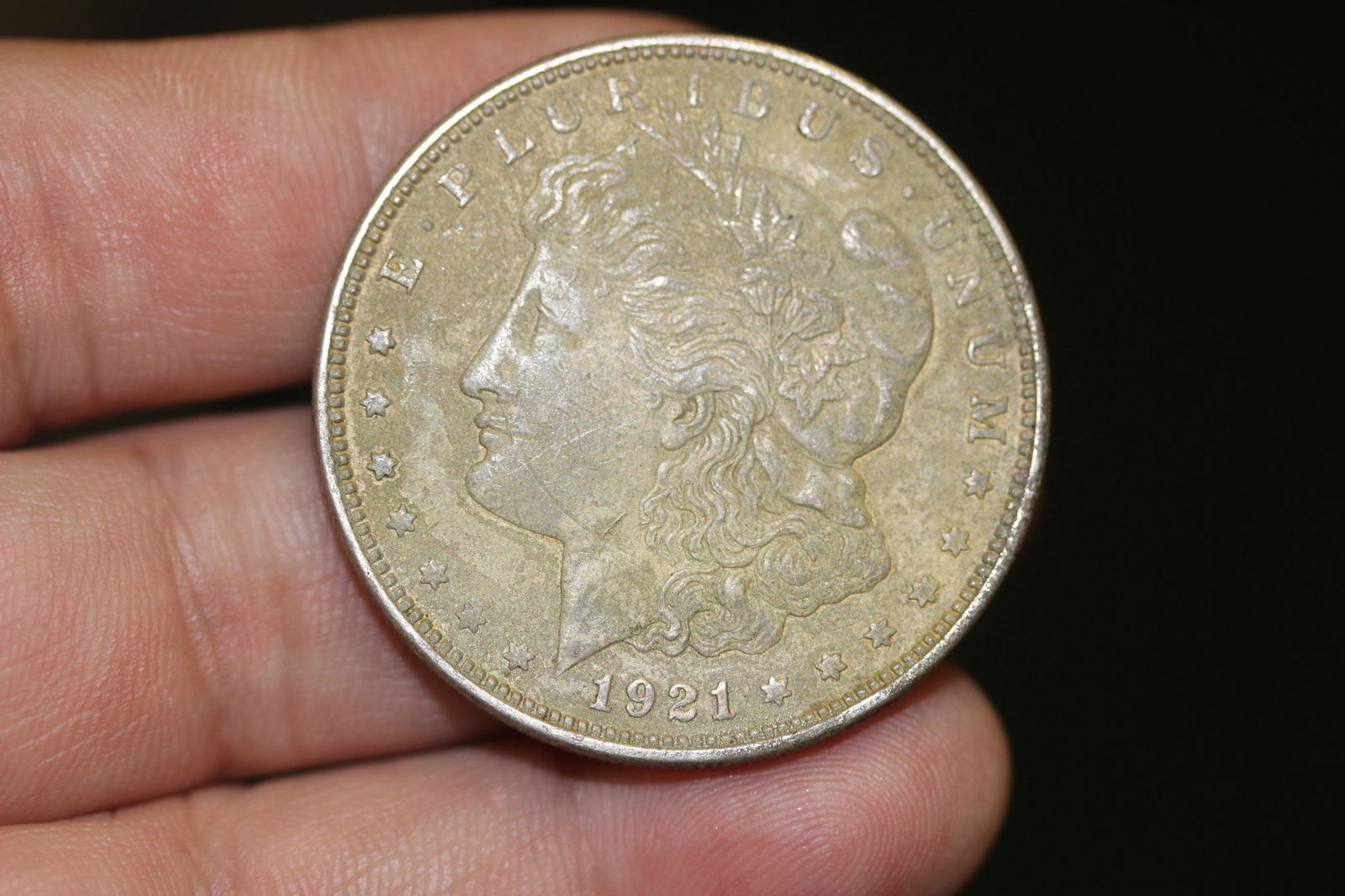 A 1921 Morgan Silver Dollar: as shown