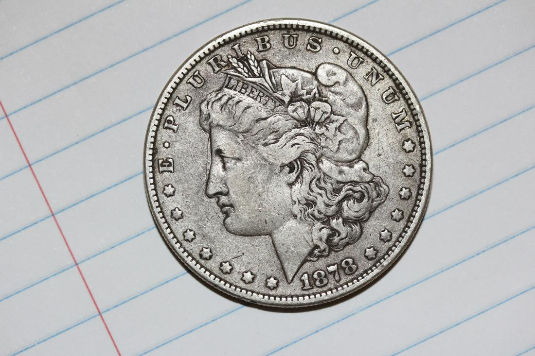 An 1878 Morgan Silver Dollar: 8TF - eight tail feathers