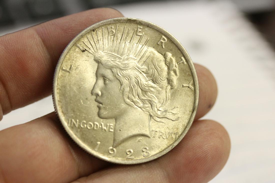 A 1923 Peace Silver Dollar: as shown