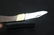 A Pocket Knife Inside a Leather Case - 2