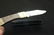 A Pocket Knife Inside a Leather Case - 3
