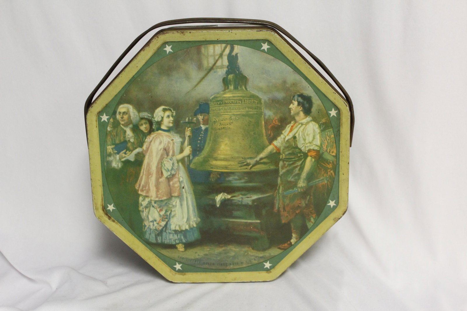 A Tin Box with Handle: 10" in diameter - most likely 1950's