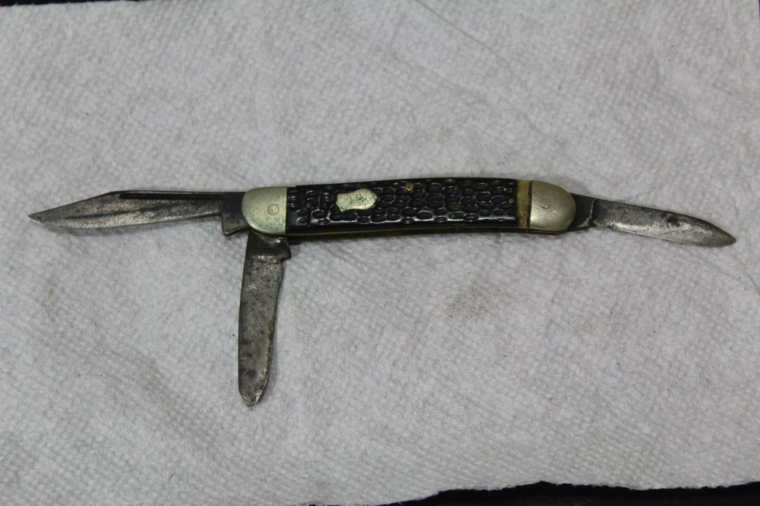 A Bone Handle Knife: 3 1/2" long - possibly elk handle - cannot make out the name of the maker