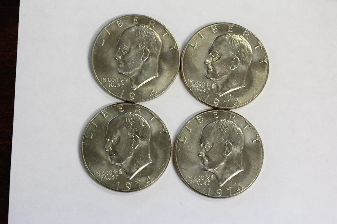 Lot of 4 Clad Ike Dollars: as shown