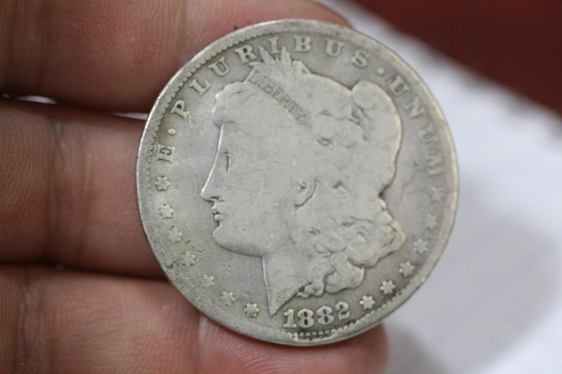 An 1882 Morgan Silver Dollar: as shown