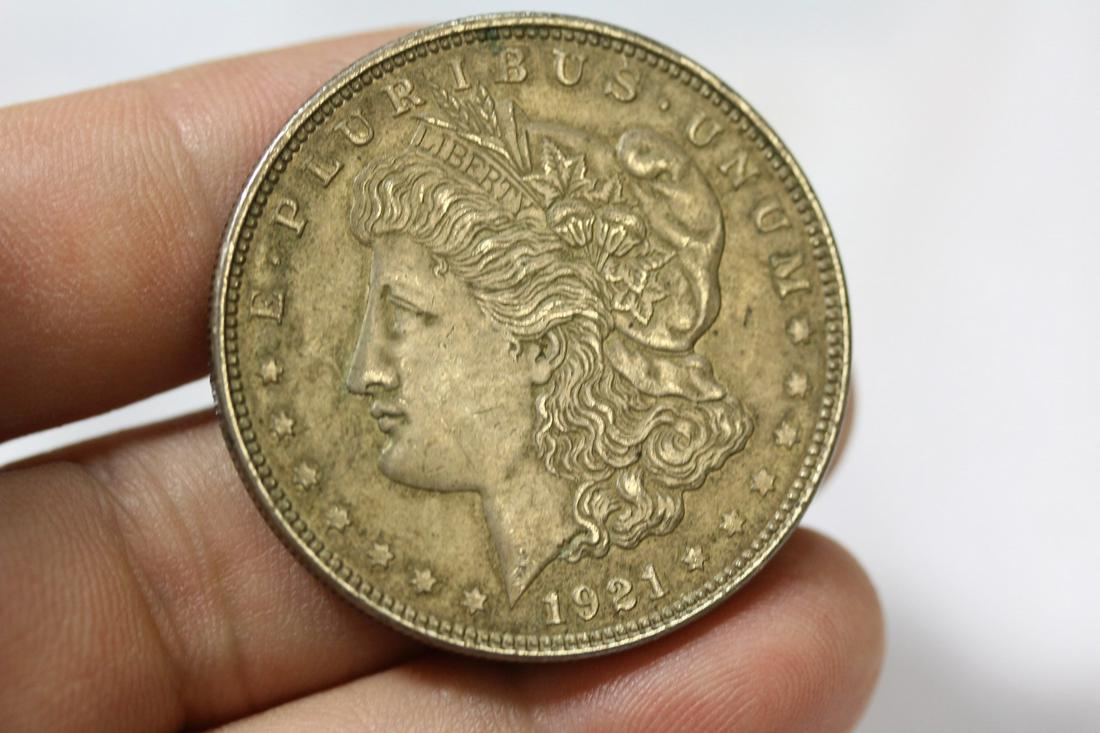 A 1921 Morgan Silver Dollar: as shown