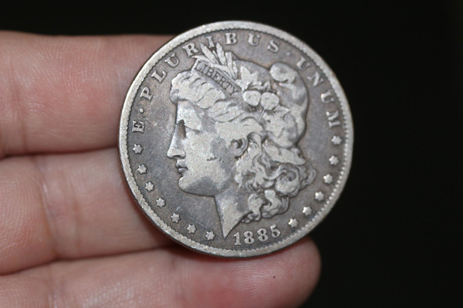 An 1885 Morgan Silver Dollar: as shown