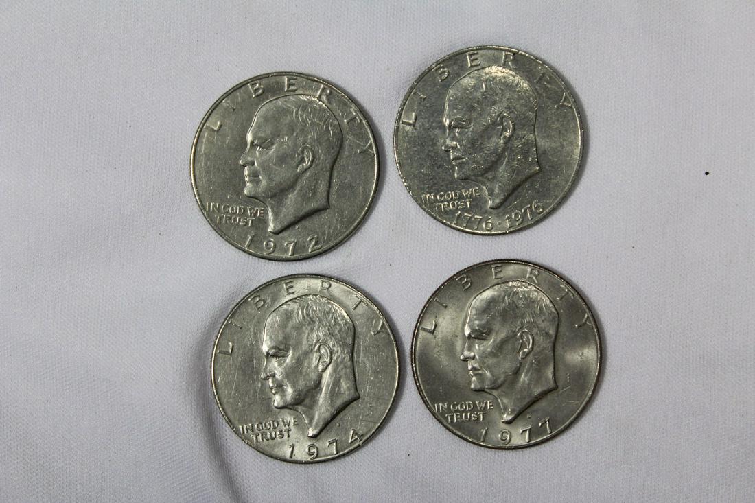 Lot of 4 Clad Ike Dollars: as shown