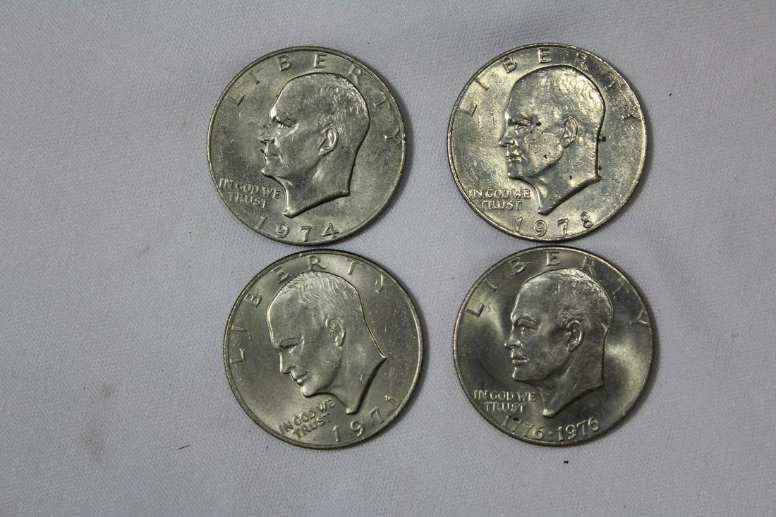 Lot of 4 Clad Ike Dollars: as shown