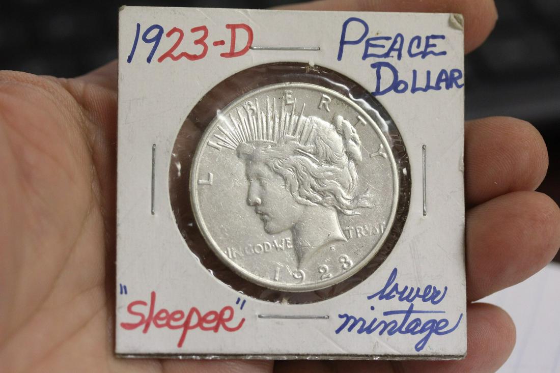 A 1923-D Peace Silver Dollar: as shown