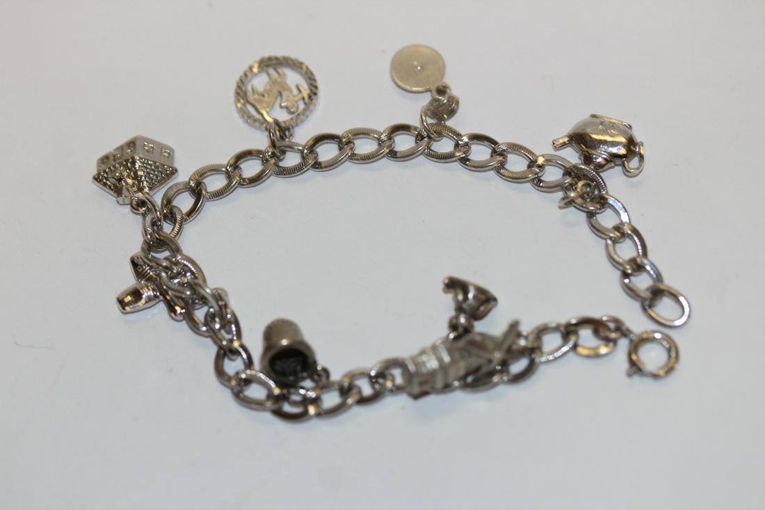A Charm Bracelet: 7 1/4" long unclapsed