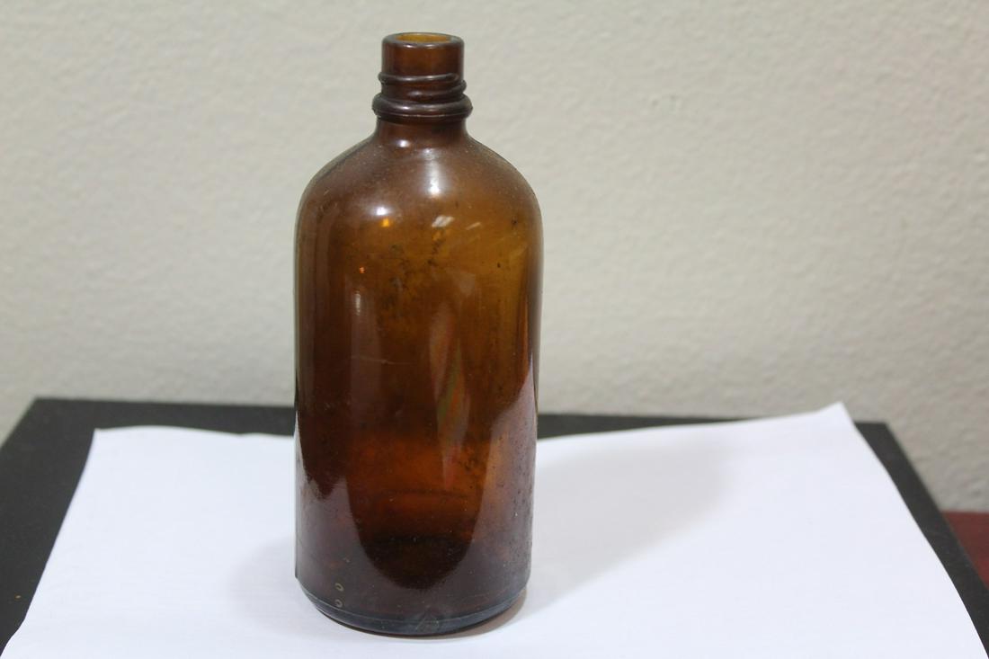 An Old Amber Glass Elixir Bottle: 5 1/2" tall