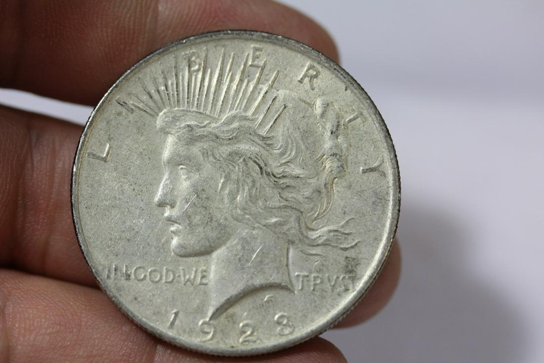 A 1923 Peace Silver Dollar: as shown