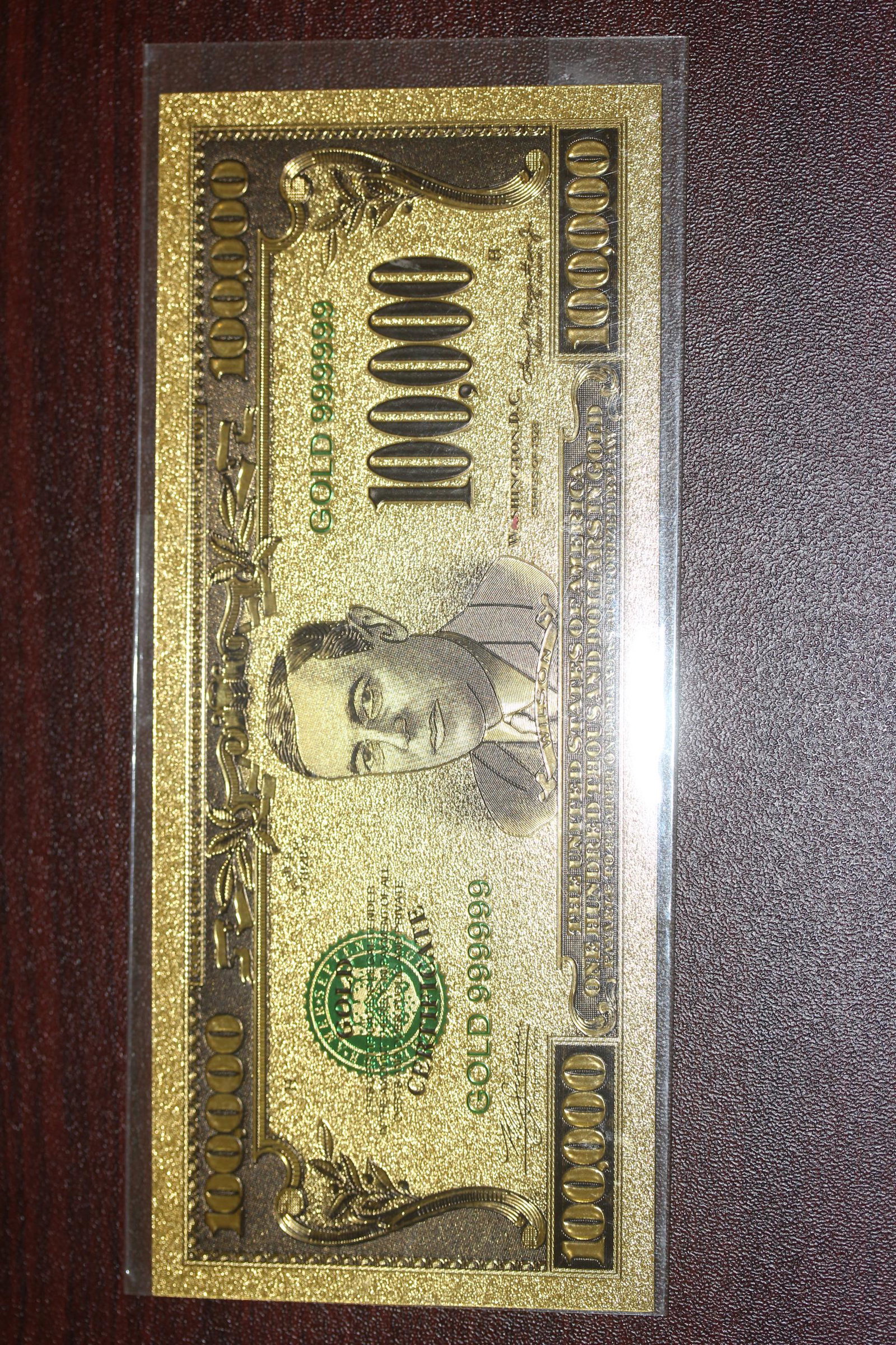 A Pure Gold Foil 100,000 Bank Note: as shown