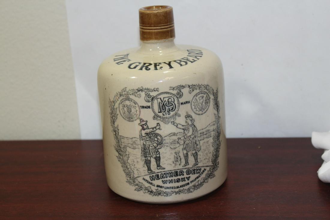 A Vintage Stoneware Whisky Jug: The Greybeard - Heather Dew whisky - Scotland - 7 inches tall