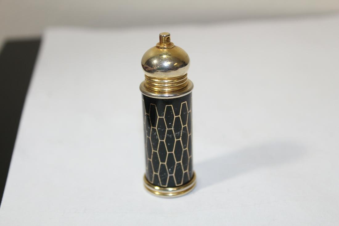 A Metal Pill Bottle: 2 3/8" tall