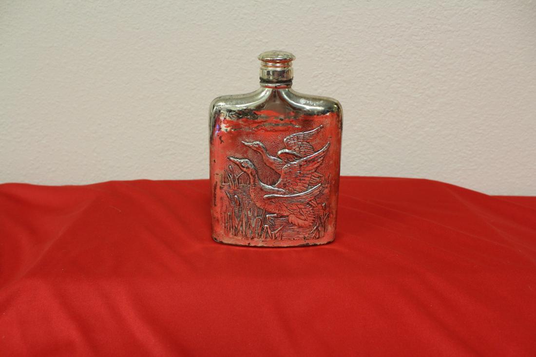 A Metal Engraved Flask: please note: slightly rusted - 6" tall x 4" across - marked on the bottom