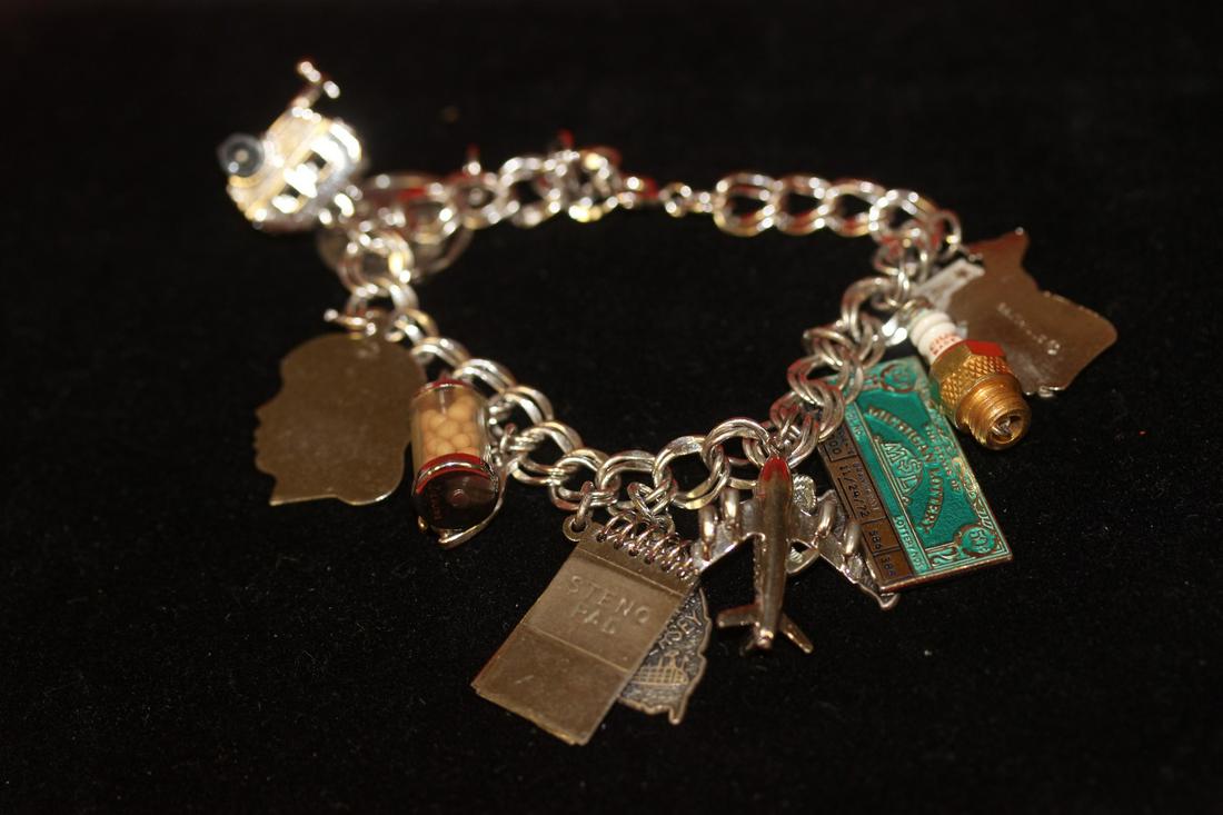 A Sterling Charm Bracelet: as shown