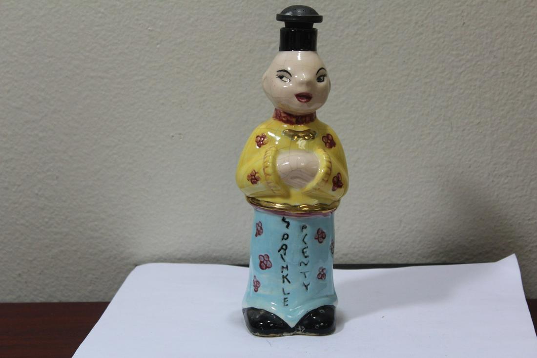 A Ceramic Bottle: possibly was once to hold spirit with rubber stopper - 8 1/4" tall