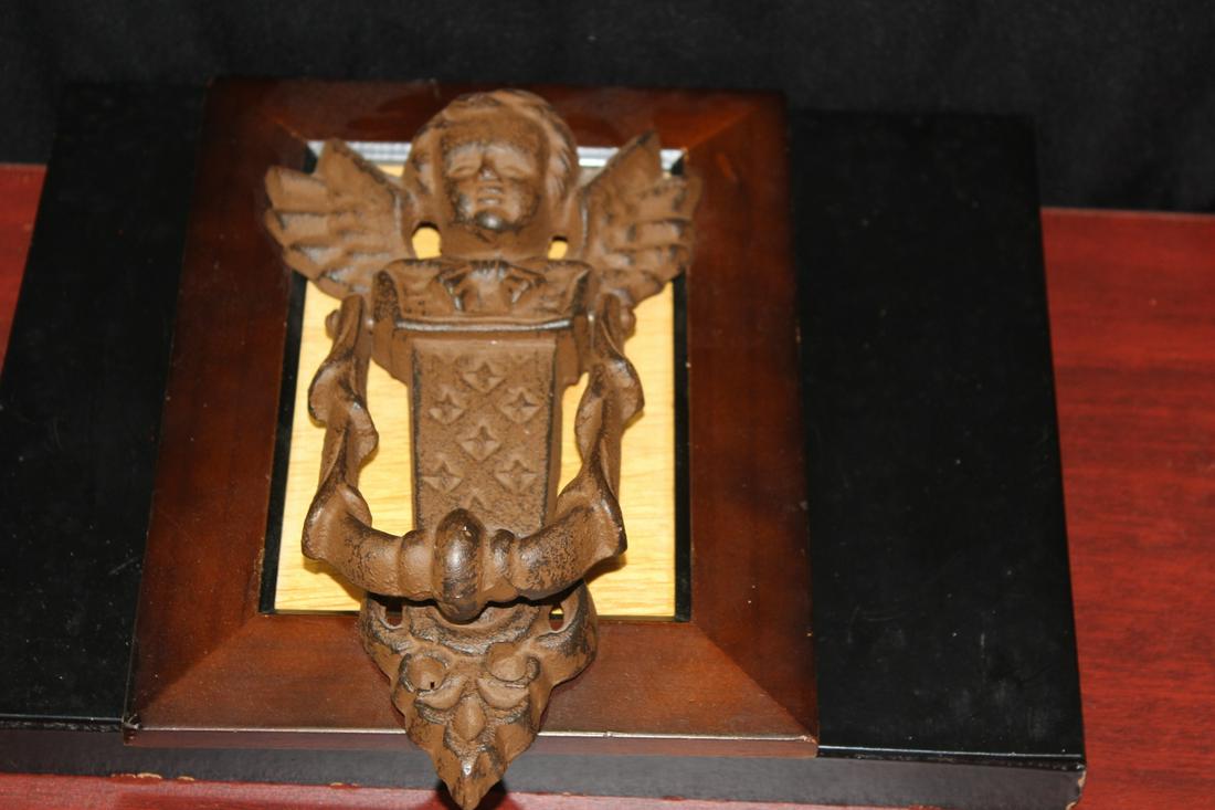 A Cast Iron Door Knocker: on frame - 8" long