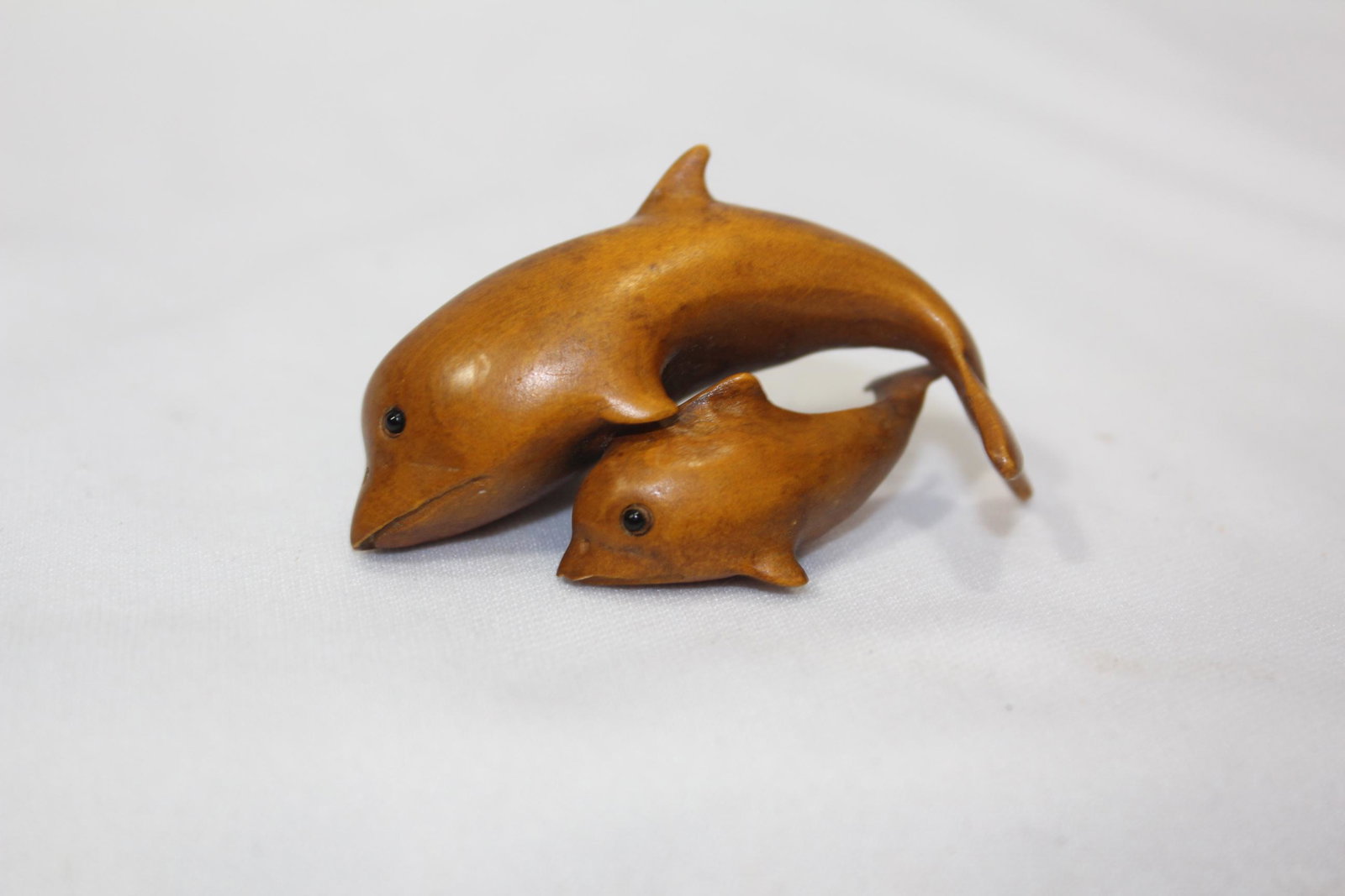 A Signed Japanese Wooden Netsuke: glass eyes
