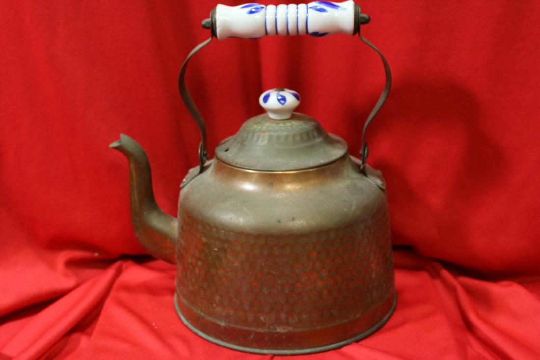 A Vintage Copper Kettle: with porcelain handle - 9 1/2" tall